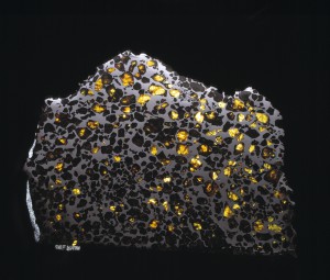 Image of the Esquel Meteorite. This meteorite consists of gem-quality olivine embedded within an Fe-Ni matrix. © The Trustees of the Natural History Museum, London